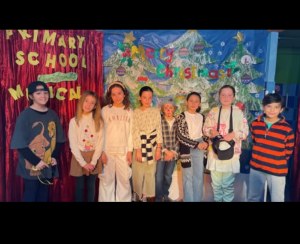 Students from the last years of primary school performing in a school play